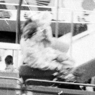 Amusement park ride with suspended seats.