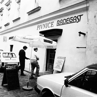 "Black-and-white street scene outside Pivnice Radegast beer hall."