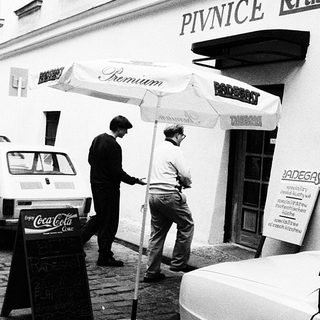 "Black-and-white street scene outside Pivnice Radegast beer hall."