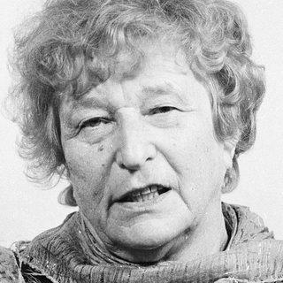 Portrait of an elderly woman wearing a scarf.