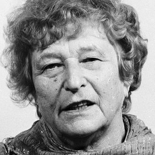 Portrait of an elderly woman wearing a scarf.
