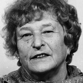 Portrait of an elderly woman wearing a scarf.