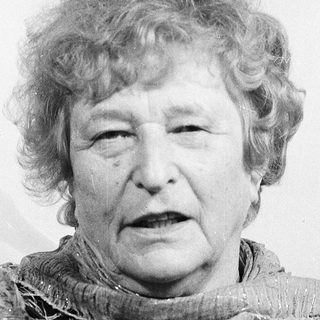 Portrait of an elderly woman wearing a scarf.