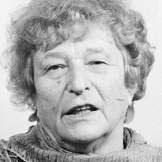 Portrait of an elderly woman wearing a scarf.