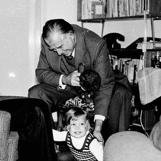 Family moment indoors with man, woman, and child.