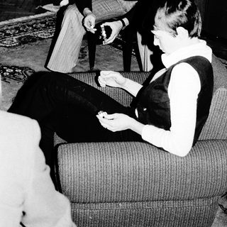 Two people playing board game indoors.