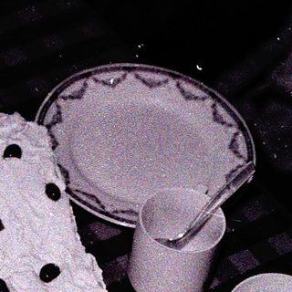 Vintage table with cake, cups, and teapot.