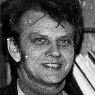 Man in office setting, mid-1970s to 1980s.