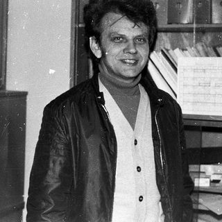 Man in office setting, mid-1970s to 1980s.