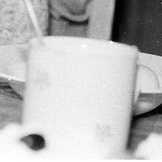 Young girl peeling and cutting boiled eggs.