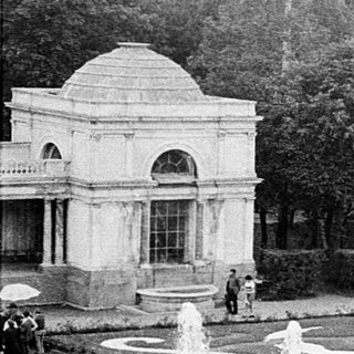 Elegant historic park fountain with classical sculptures.