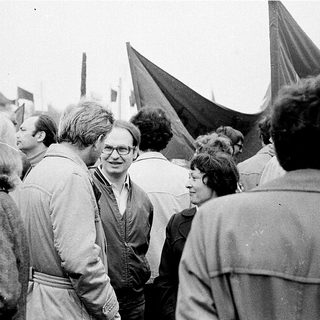 People gathered outdoors at a protest or rally.
