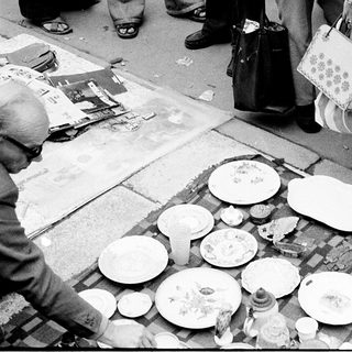 Street market selling secondhand or broken plates.