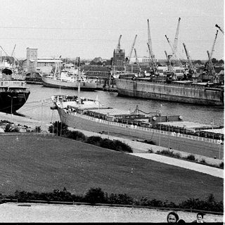 Port with docked ships and industrial harbor.