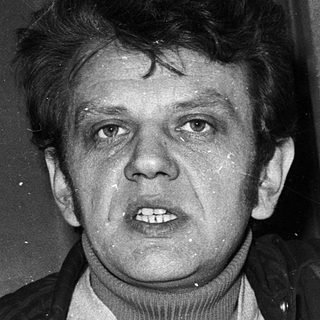 Young man in turtleneck and leather jacket.