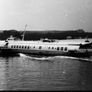 Vintage ferryboat on a river.