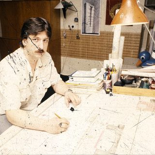 Artist working on large-scale abstract painting.