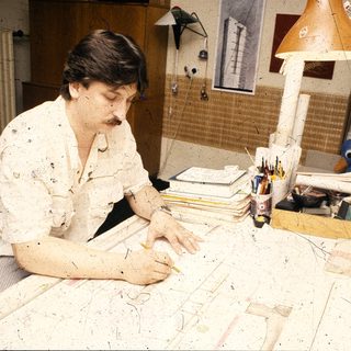 Artist working on large-scale abstract painting.