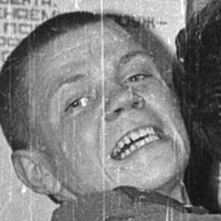 Two men playing prank with poster.