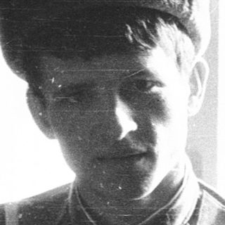 Young man in early 20th-century military uniform.