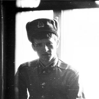 Young man in early 20th-century military uniform.