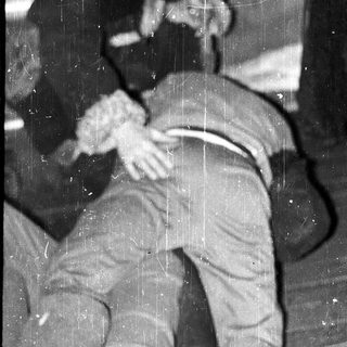 Two men engaged in a physical altercation.