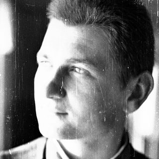Young man in early 20th-century military uniform.