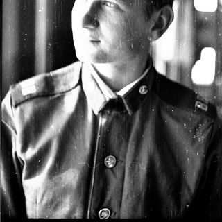 Young man in early 20th-century military uniform.