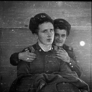 Two women in military uniforms, mid-20th century.