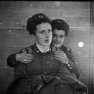 Two women in military uniforms, mid-20th century.