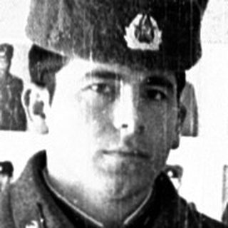 Two young men in Soviet military uniforms, posing for a photo.