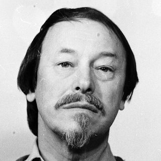 Portrait of a middle-aged man with beard and mustache.