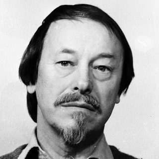 Portrait of a middle-aged man with beard and mustache.