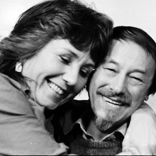 Joyful couple sharing a tender moment indoors.