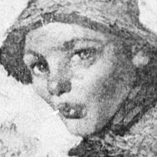 Young child sitting in front of vintage painting.