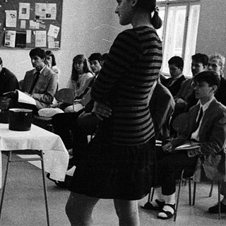 Classroom setting with students taking an exam.