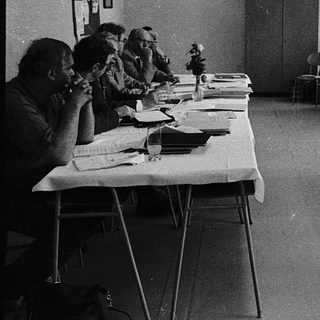 Classroom setting with students taking an exam.
