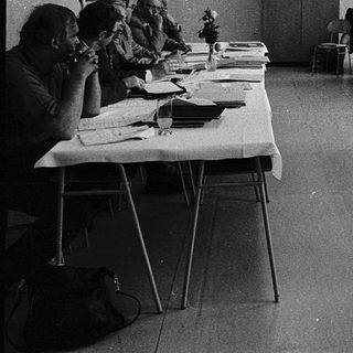 Classroom setting with students taking an exam.