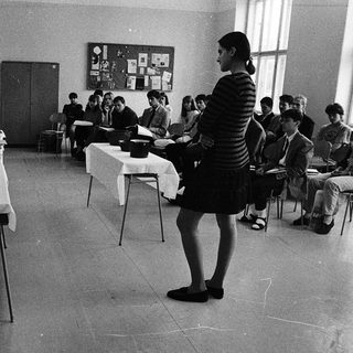 Classroom setting with students taking an exam.