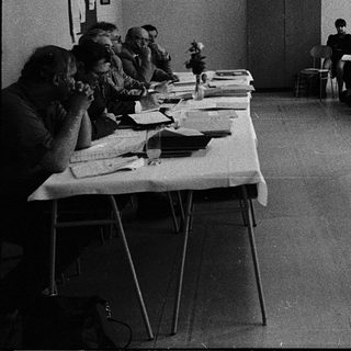 Classroom setting with instructor teaching seated students.