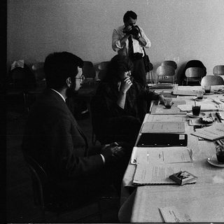 Business meeting with people discussing documents.