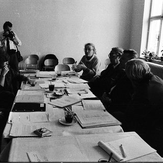 Business meeting with people discussing documents.