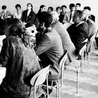 Classroom lecture with students using early computers.