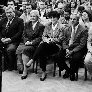 Formal audience listening to a speaker.