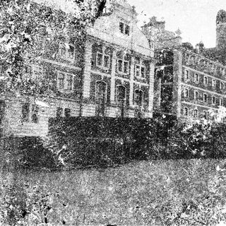 Historic grand mansion with tall towers.
