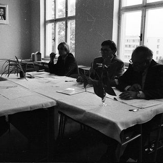 Four women studying or working together indoors.
