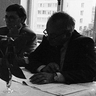 Four women studying or working together indoors.