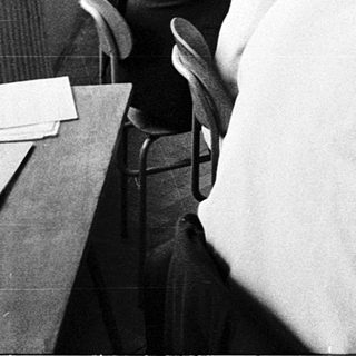 Classroom with students using early computer terminals.