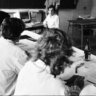 Classroom with students using early computer terminals.