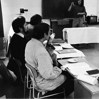 Classroom lecture with professor teaching students.